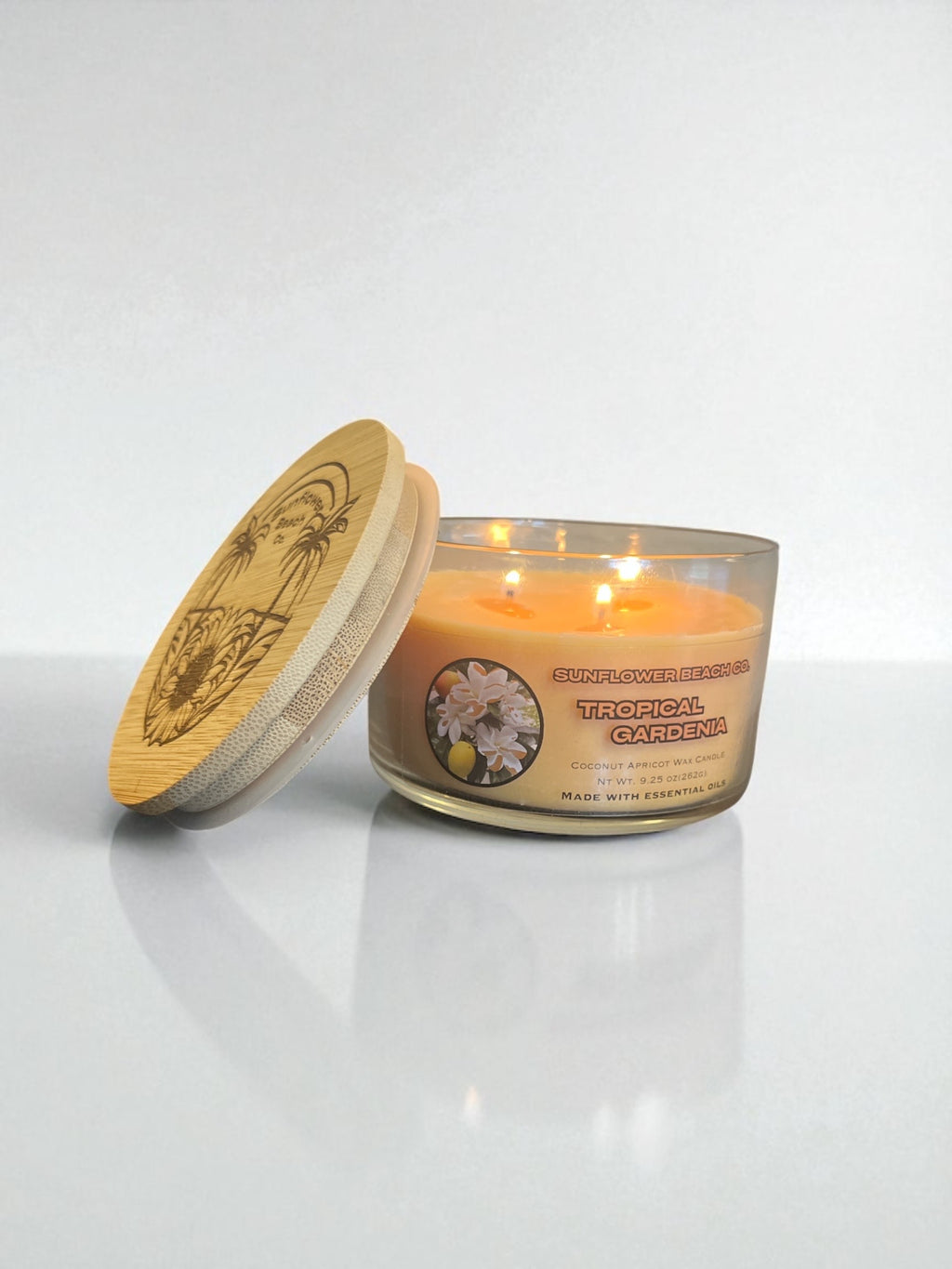 Bamboo Lid resting on the edge of a tropical gardenia three wick candle