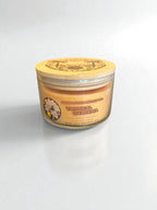 Bamboo lid on top of a tropical gardenia three wick essential oil candle